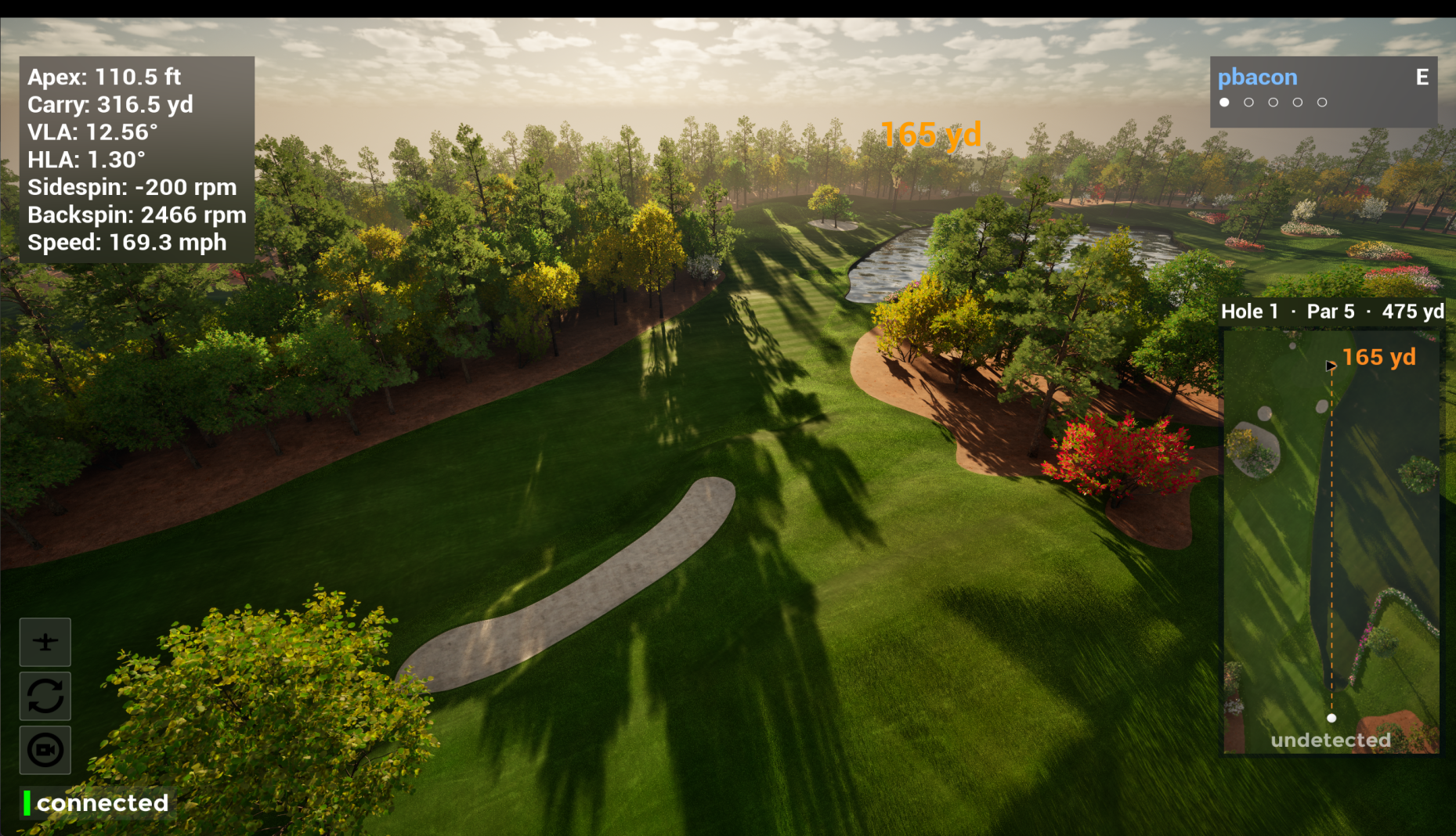 A golf hole in Infinite Tees golf simulator software, rendered in Unreal Engine with trees, shadows and the green in the distance