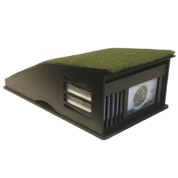 The Projector Shield floor enclosure with a turf ramp on top and a projector lens showing through the front
