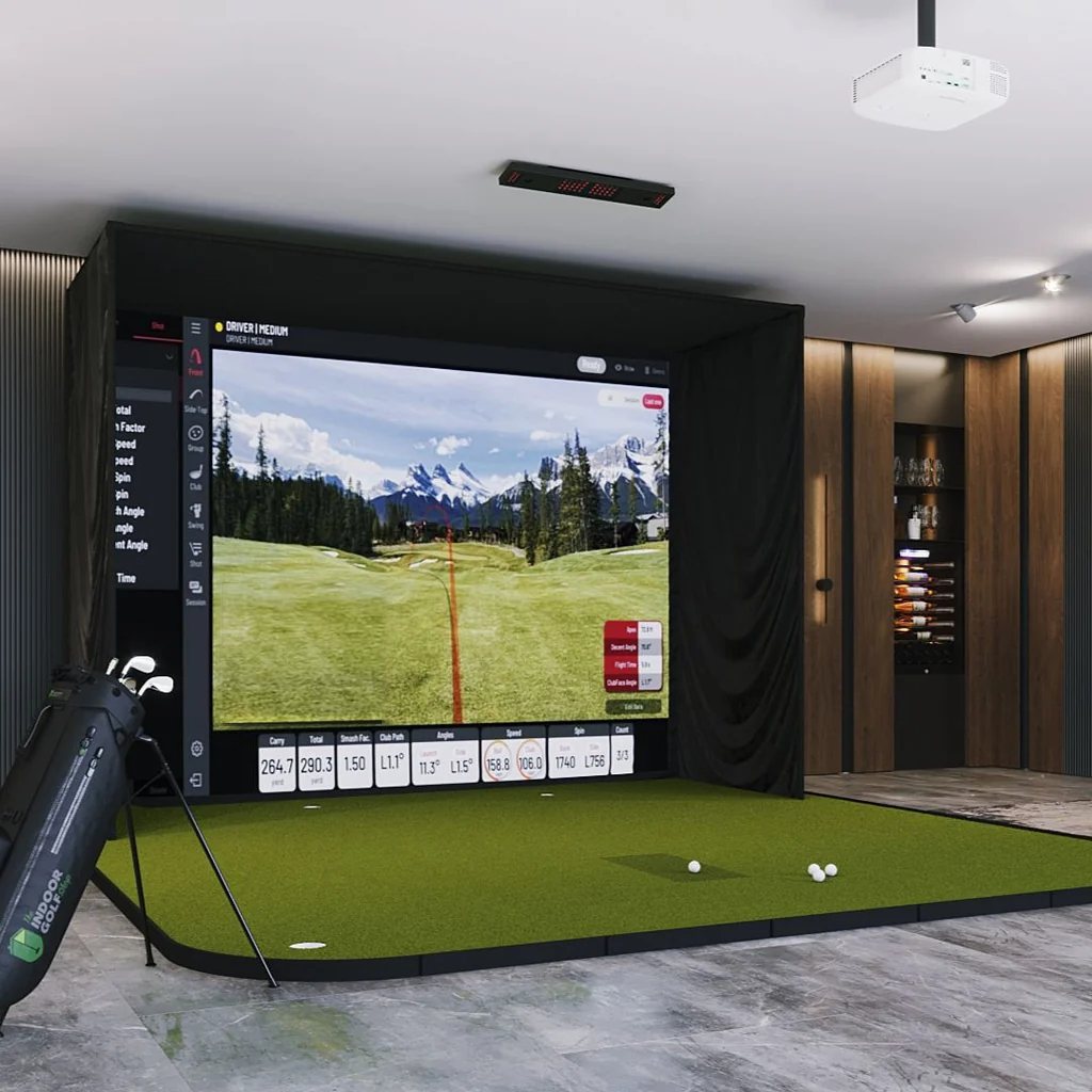 A finished golf simulator room with a Uneekor launch monitor on the ceiling ahead of the hitting area, an enclosure, an impact screen and a projector